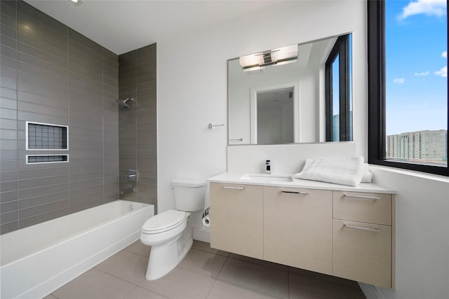 full bathroom with vanity, toilet, tiled shower / bath combo, and tile patterned flooring