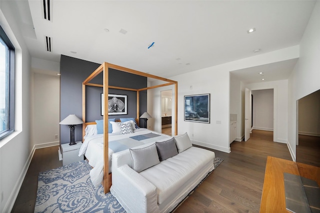 bedroom featuring dark hardwood / wood-style flooring