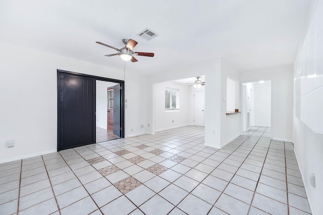 tiled empty room with ceiling fan