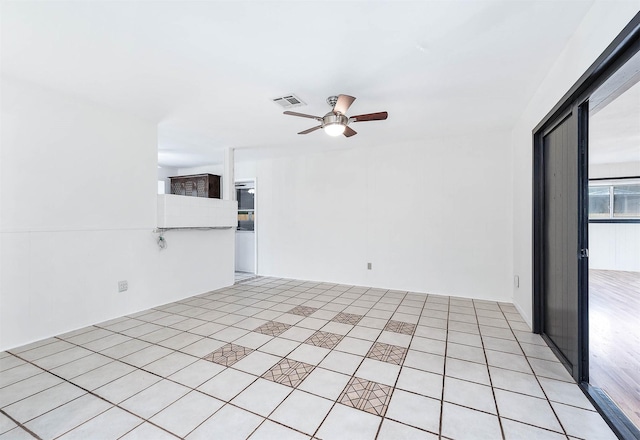 unfurnished room featuring ceiling fan