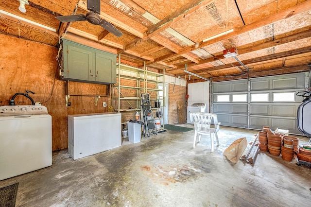 garage featuring washer / clothes dryer, a garage door opener, fridge, and ceiling fan