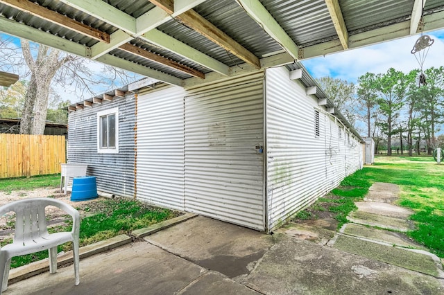 view of side of home featuring a patio area