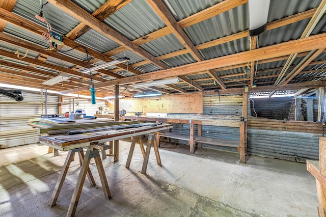 misc room featuring concrete floors and a workshop area