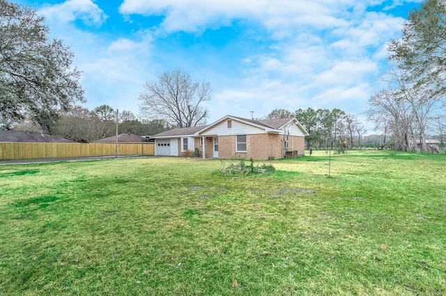 view of yard with a garage