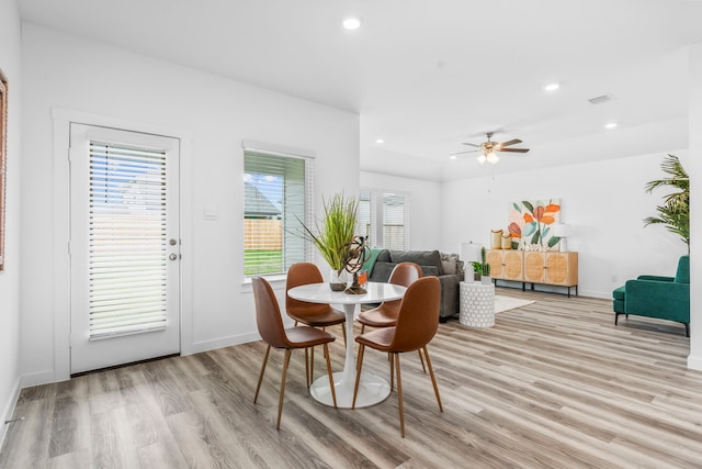 dining room featuring ceiling fan and light wood-type flooring