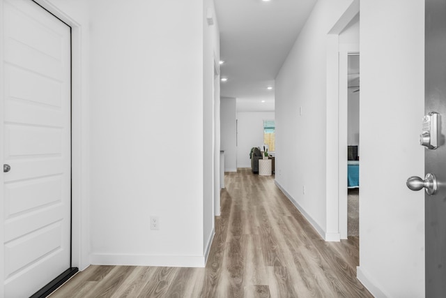 corridor featuring light hardwood / wood-style floors