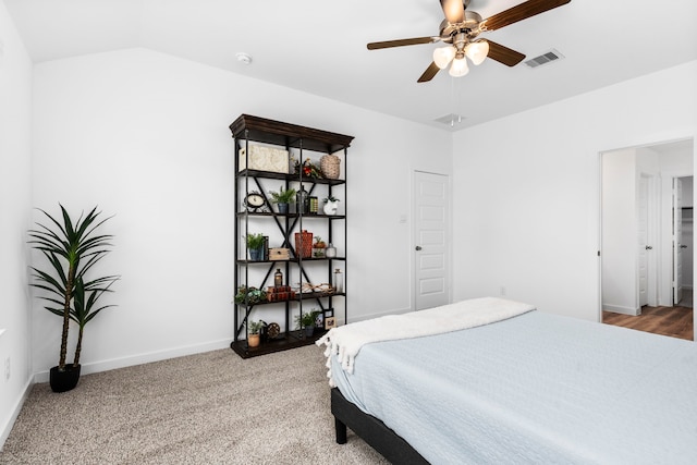 bedroom with lofted ceiling, carpet flooring, and ceiling fan