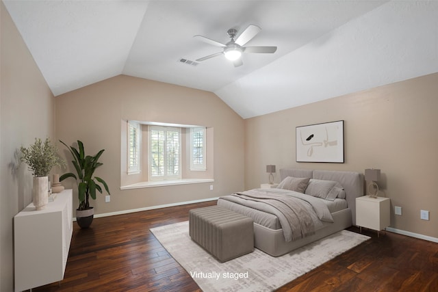 bedroom featuring ceiling fan, lofted ceiling, and dark hardwood / wood-style flooring