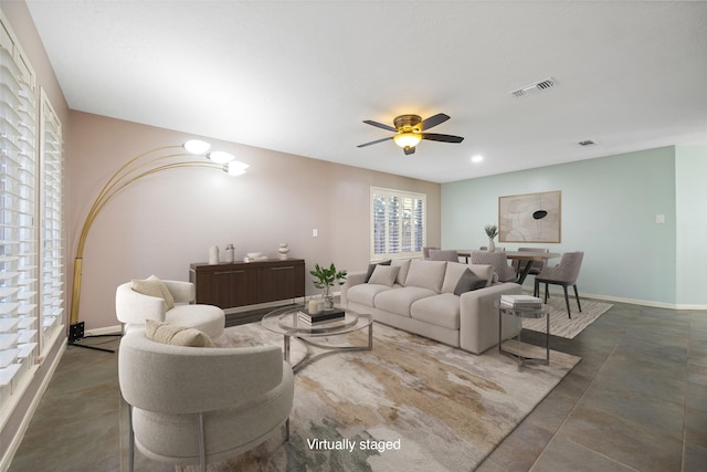 living room featuring ceiling fan