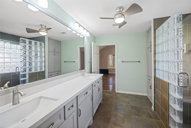 bathroom with ceiling fan and vanity