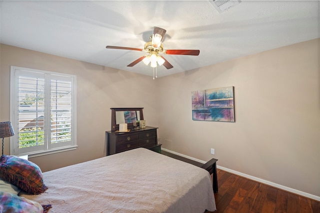 bedroom featuring dark hardwood / wood-style flooring and ceiling fan