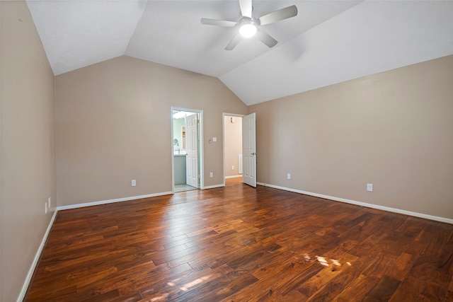 interior space with ceiling fan, dark hardwood / wood-style floors, and vaulted ceiling