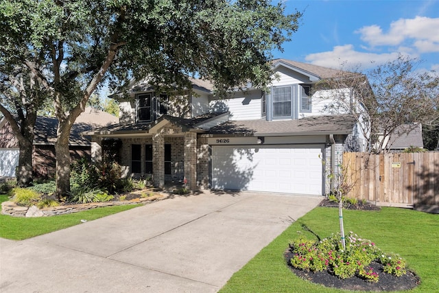 view of front of home with a garage and a front yard