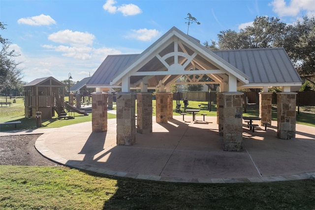 view of community with a gazebo, a lawn, and a playground