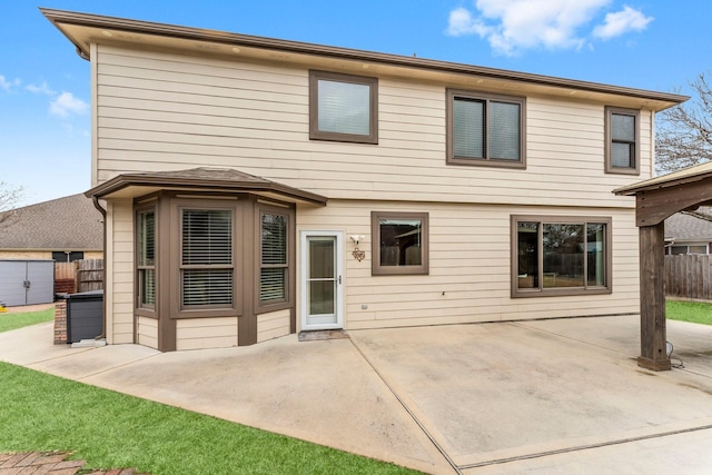 back of house with a patio