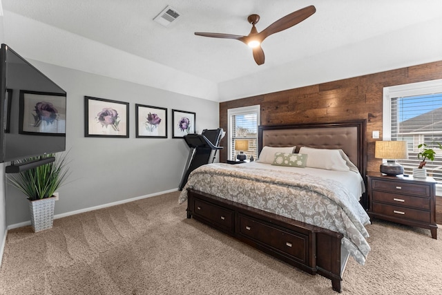 carpeted bedroom with ceiling fan and lofted ceiling