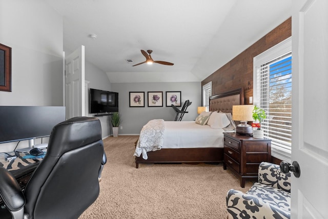 bedroom with lofted ceiling, light carpet, and ceiling fan