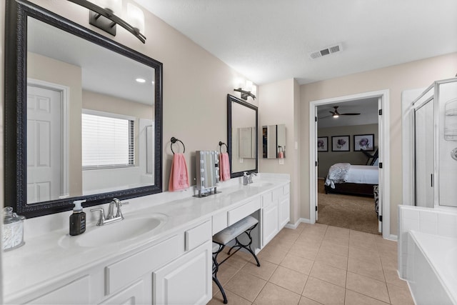 bathroom featuring tile patterned flooring, vanity, plus walk in shower, and ceiling fan