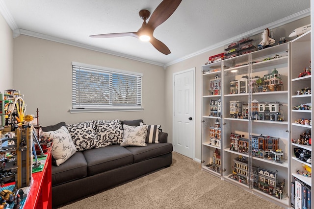 living area featuring crown molding, carpet floors, and ceiling fan