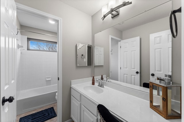 full bathroom featuring shower / bath combination, vanity, and toilet