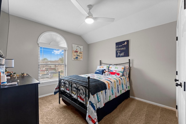 bedroom with lofted ceiling, light carpet, and ceiling fan