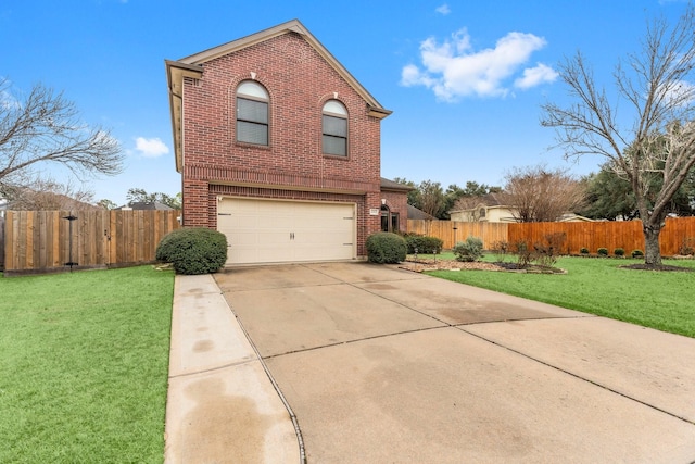 view of front of house featuring a garage and a front lawn