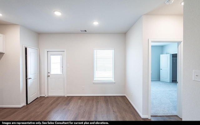 14119 Gingko Ct, Crosby, TX 77532 - foyer entrance featuring wood finished floors, baseboards, and recessed lighting