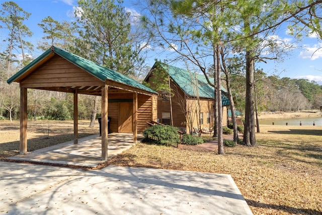 view of property's community featuring an outbuilding