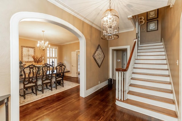 interior space with ornamental molding, dark wood-type flooring, and a chandelier