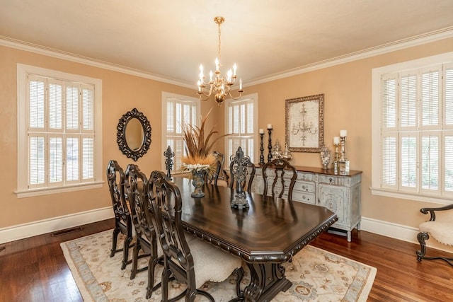 dining room featuring a healthy amount of sunlight, a notable chandelier, and dark hardwood / wood-style floors