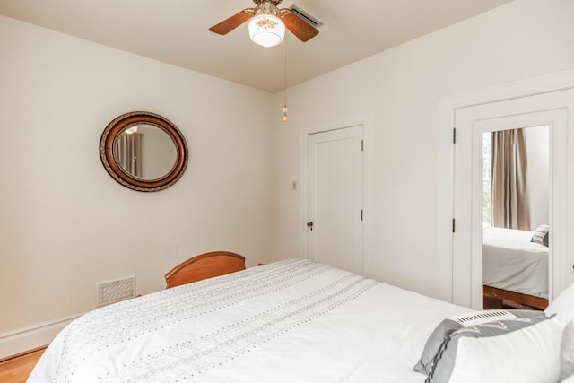 bedroom featuring hardwood / wood-style flooring and ceiling fan