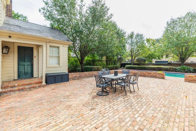 view of patio / terrace with a fenced in pool