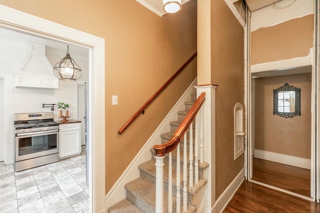 staircase featuring hardwood / wood-style flooring