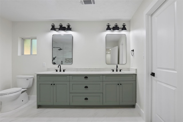 bathroom with walk in shower, vanity, and toilet