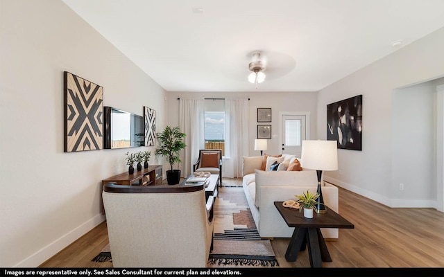 14123 Gingko Ct, Crosby, TX 77532 - living area featuring baseboards, wood finished floors, and a ceiling fan