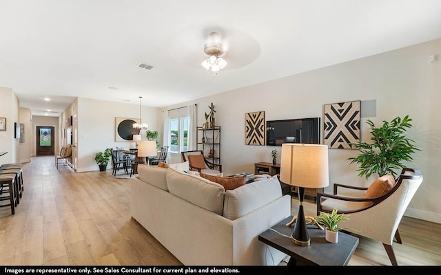 14123 Gingko Ct, Crosby, TX 77532 - living area featuring light wood-style floors and baseboards