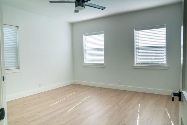 spare room featuring ceiling fan and light hardwood / wood-style floors