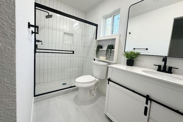 bathroom featuring vanity, toilet, and walk in shower