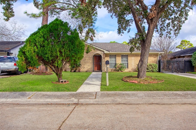 ranch-style home with a front yard