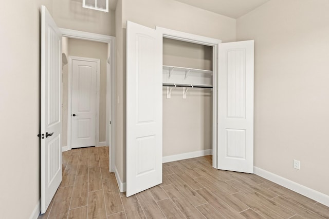 unfurnished bedroom with a closet