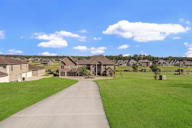 view of front of property with a garage and a front yard