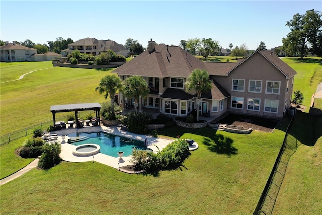 view of swimming pool featuring a gazebo, a lawn, and an in ground hot tub