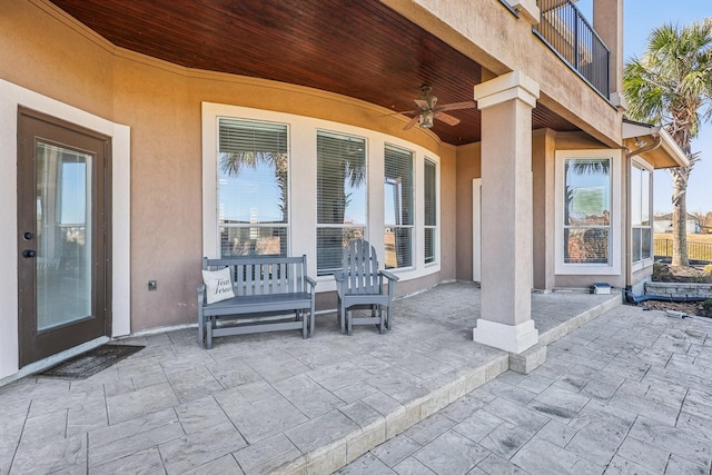 view of patio featuring ceiling fan