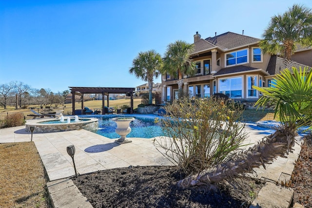 view of swimming pool with an in ground hot tub, a pergola, and a patio area