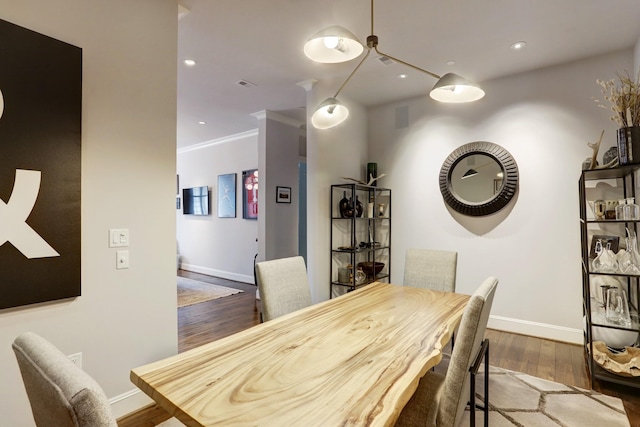 dining space with recessed lighting, dark wood finished floors, and baseboards