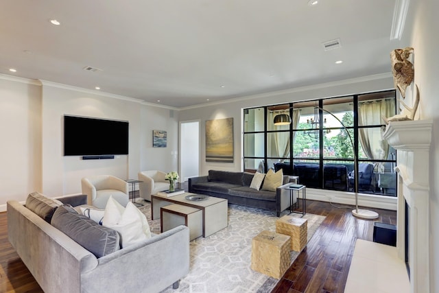 living room featuring recessed lighting, visible vents, crown molding, and wood finished floors