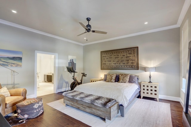 bedroom featuring ensuite bath, baseboards, crown molding, and wood finished floors