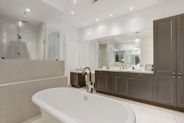 full bathroom featuring recessed lighting, a soaking tub, a shower stall, and vanity