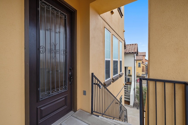 entrance to property with a balcony