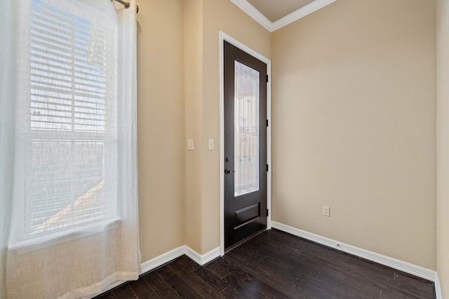 entryway with dark wood-type flooring, a healthy amount of sunlight, and crown molding